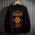 Black crewneck sweatshirt featuring Goku shadow silhouette with blue and pink neon aura and vertical Japanese text, flat lay on grey background.