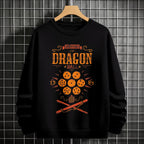 Black crewneck sweatshirt featuring Goku shadow silhouette with blue and pink neon aura and vertical Japanese text, flat lay on grey background.