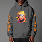Black pullover hoodie featuring Naruto Uzumaki portrait on chest and vertical orange Japanese Kanji text on sleeves, worn by model on grey background.