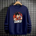 Black crewneck sweatshirt featuring Goku shadow silhouette with blue and pink neon aura and vertical Japanese text, flat lay on grey background.