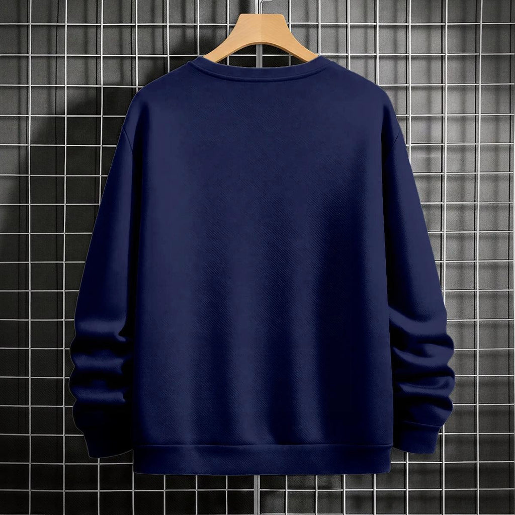 Black crewneck sweatshirt featuring two vertically stacked circular Dragon Ball Z 'Go' Kanji symbols (one orange, one white), flat lay on grey background.